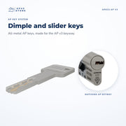 An all-metal APECS AP key beside a close-up of the AP v3 cylinder's keyway